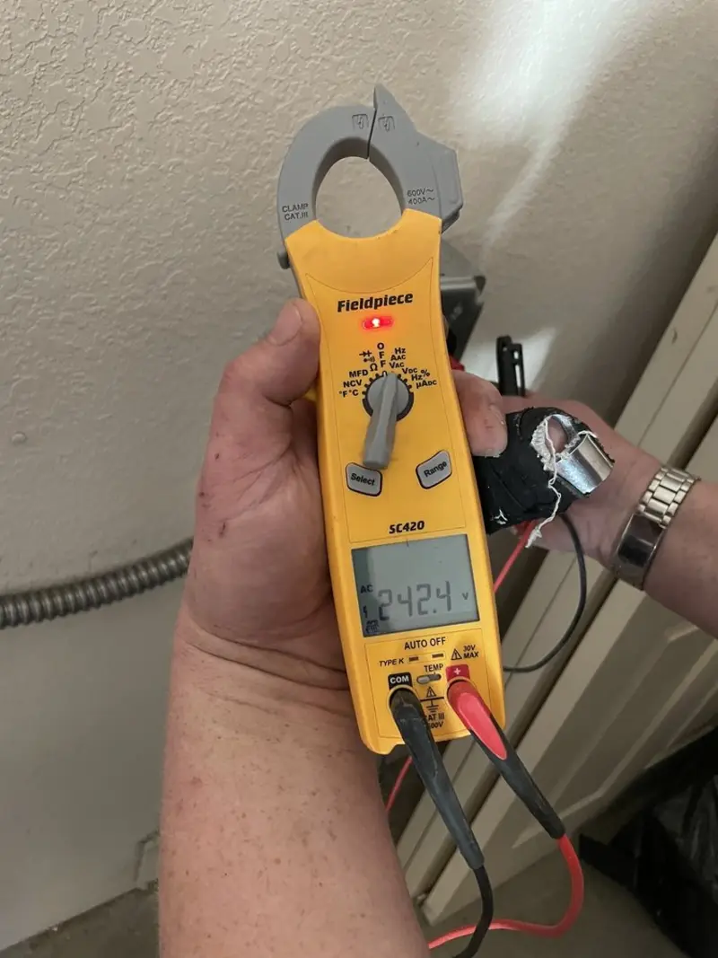 Voltage testing with clamp meter during Ceiling Fan Installation in Lampasas